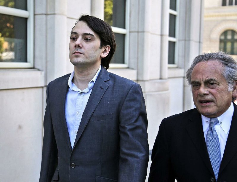 Former Turing Pharmaceuticals CEO Martin Shkreli (left) arrives at federal court in New York on Monday with his attorney, Benjamin Brafman, for the opening day of his securities fraud trial. 