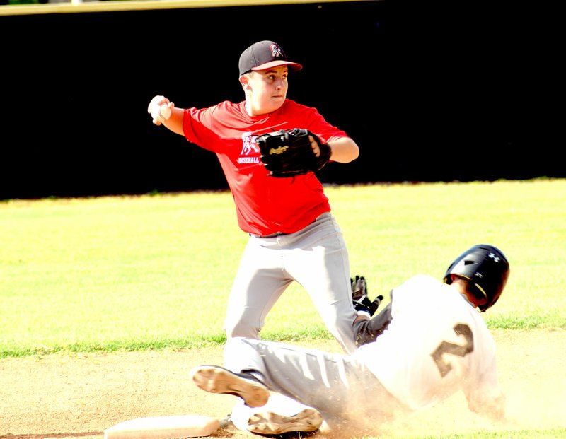 Photo by Rick Peck McDonald County second baseman Cory Creason forces out a Neosho runner before throwing to first for an attempted double play during McDonald County&#8217;s 8-6 win on June 22 at Neosho High School.