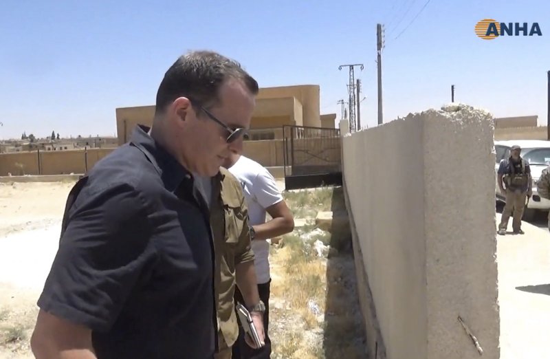 This frame grab from video released Wednesday June 28, 2017, by ANHA news agency for the semi-autonomous Kurdish areas in Syria, that is consistent with independent AP reporting, shows Brett McGurk, the top U.S. envoy for the international coalition combatting the Islamic State group, leaving after a visit to Ayn Issa, Syria. McGurk met with members of a local council expected to administer the city of Raqqa in Syria following its capture from the militants. (ANHA News Agency, via AP)