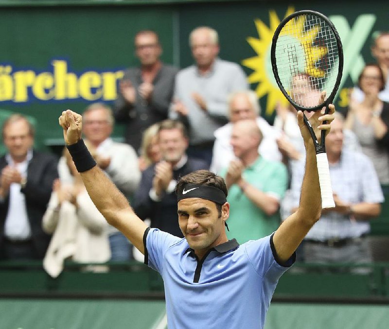 Switzerland's  Roger Federer celebrates his victory in the final match against  Germany's Alexander Zverev at the Gerry Weber Open tennis tournament in Halle, Germany, Sunday, June 25, 2017.  