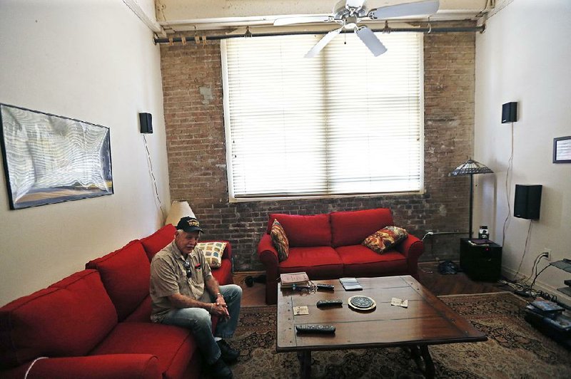 Michael Esnault sits in his apartment at American Can Apartments in New Orleans in March. Esnault moved to a new home after American Can management told him his rent was going to double to $1,400 a month. 