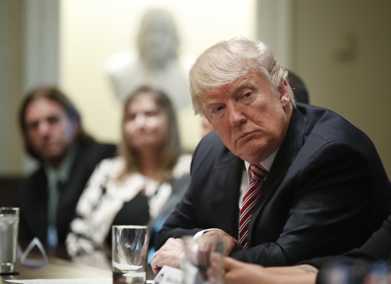 President Donald Trump meets with what the White House identifies as &quot;immigration crime victims&quot; to urge passage of House legislation to save American lives, Wednesday, June 28, 2017, in the Cabinet Room at the White House in Washington. (AP Photo/Manuel Balce Ceneta)