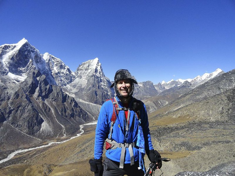 Small business owner Mike Scanlin poses for a photo on the trail to Mount Everest Base Camp in Nepal in 2012. 