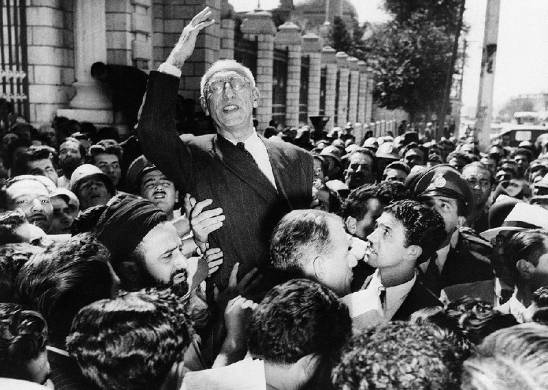 Supporters carry then-Prime Minister Mohammed Mosaddegh through Tehran’s Majlis Square on Sept. 27, 1951, in a show of support for his oil nationalization stand. Two years later, he was ousted in a coup engineered by the CIA.