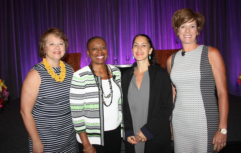 Lori Brown (from left), Tracey Brown, Liza Landsman and Sarah Semrow gather at Women’s Day at the LPGA breakfast networking event June 22 at the John Q. Hammons Center in Rogers.