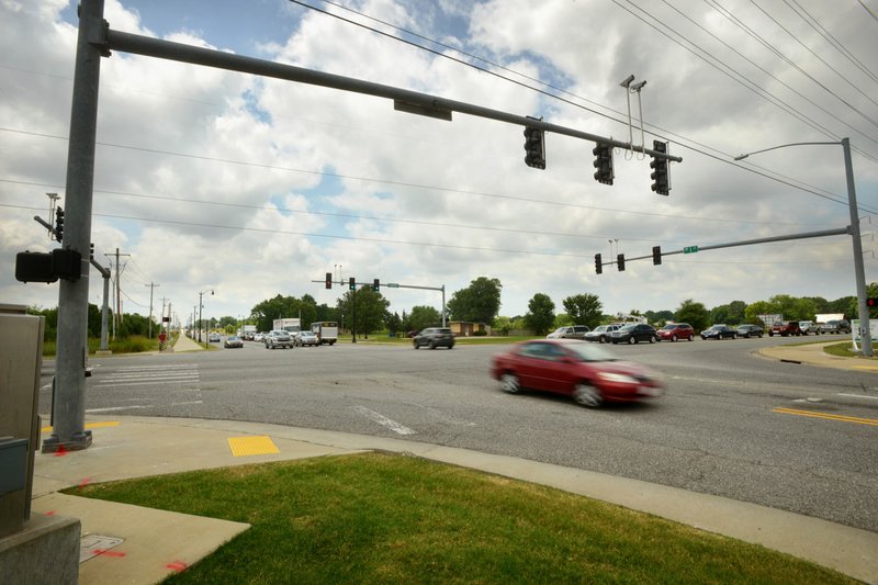 NWA Democrat-Gazette/BEN GOFF  @NWABENGOFF In this file photo traffic flows through the intersection of Southwest I Street and Southwest 14th Street in Bentonville.