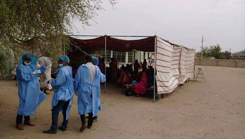 In this handout photo provided by the Central Committee of Sudanese Doctors, taken in June 2017, doctors work in makeshift tents to treat victims with acute diarrhea in White Nile state, Sudan. The government denies the country is suffering from a cholera outbreak although doctors and diplomats have reported confirmed cases, and hundreds have died since late May. 