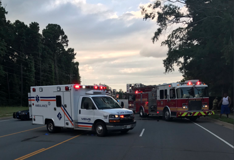 This Little Rock Police Department photo shows emergency vehicles blocking Stagecoach Road after a fatal traffic crash Monday night. 