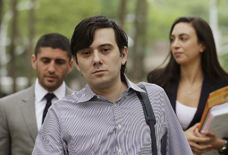 Martin Shkreli (center) arrives at Brooklyn federal court with members of his legal team on June 19 in New York.
