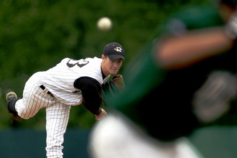 Bentonville's Brandon Laney throws against Pulaski Mills in their Class AAAAA tournament matchup May 4, 2002, in Little Rock.