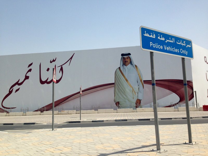 An image of Qatar's emir, Sheikh Tamim bin Hamad Al Thani, graces a billboard featuring the slogan "We are all Tamim" in Doha, Qatar, on Monday, July 3, 2017. A group of Arab nations has extended a deadline for Qatar to respond to their list of demands in a diplomatic crisis roiling the Gulf by 48 hours, saying Kuwait's emir requested the delay as part of his efforts to mediate the dispute. 