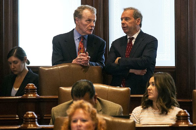 Illinois House Speaker Michael Madigan (left) and Senate President John Cullerton confer Tuesday on the Senate floor at the state Capitol in Springfield.   