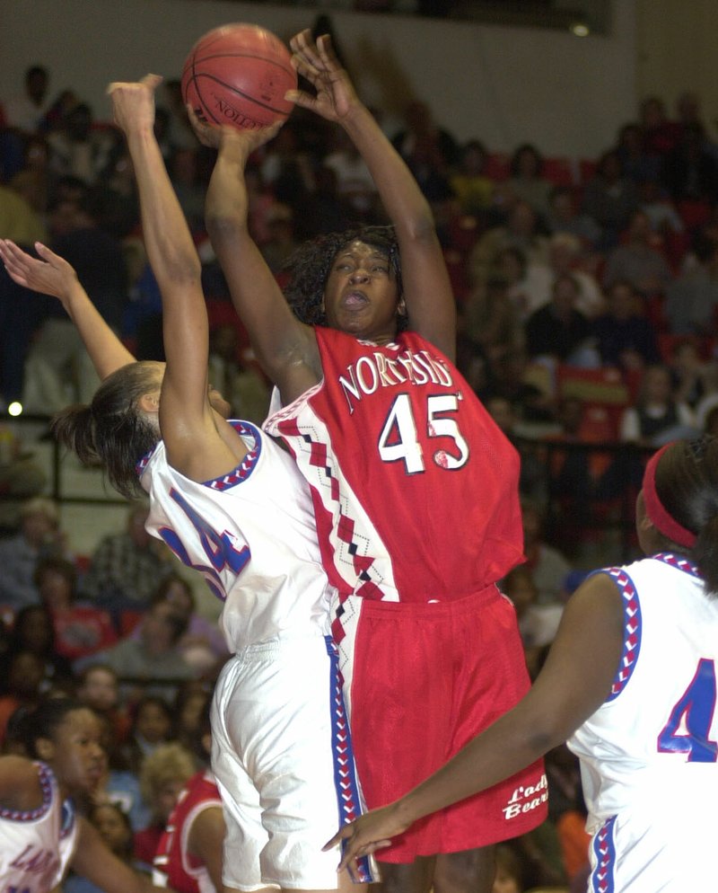 File PhotoArkansas Democrat-Gazette Tamika Kursh (now Williams) of Fort Smith Northside (45) drives to the basket through a West Memphis defender during the 2002 Class 5A state girls basketball championship game in Pine Bluff.