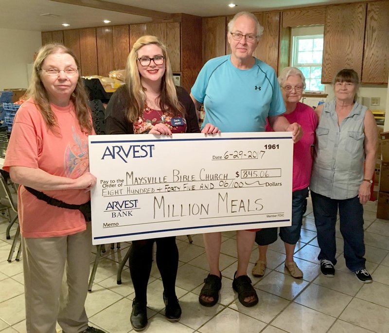 Submitted Photo Sara Huckleberry, Arvest&#8217;s Million Meals champion (second from left), presented a check for $845 to James Whisenant, pastor of the Maysville Bible Church, his wife Barbara, Carol Loux and Connie Wilkerson for the food pantry operated by Maysville Bible Church last week.