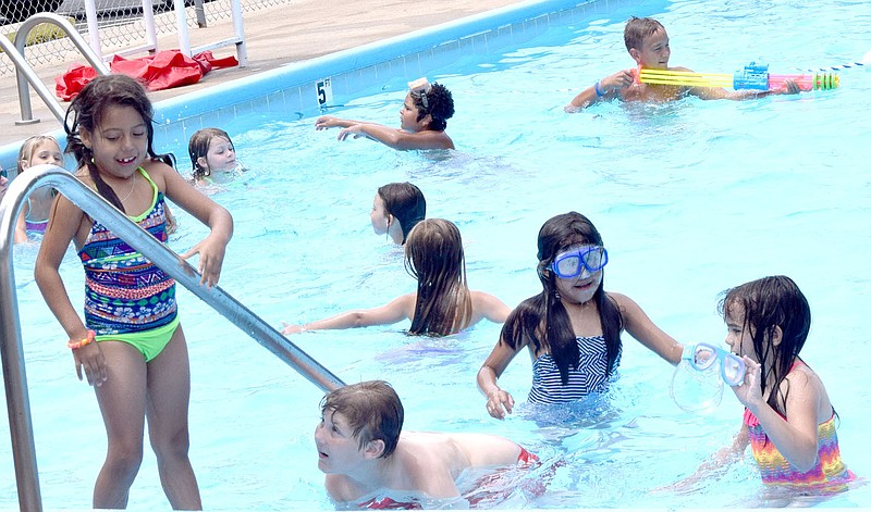 Photo by Mike Eckels A small group of kindergarten, first and second graders from the Decatur School District&#8217;s summer program gather near the shallow end of the Decatur Pool at the Old City Park in Decatur June 27.