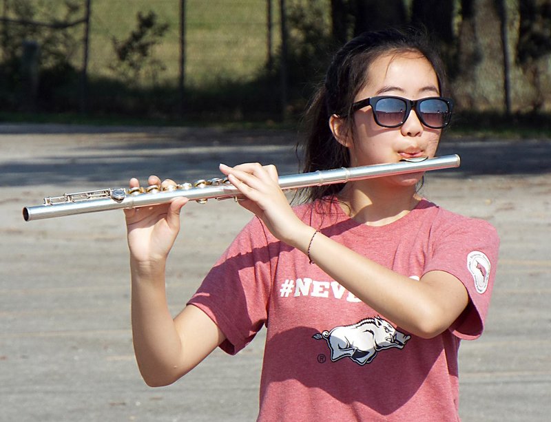 Photo by Randy Moll Chachi Vang plays the flute during a summer band practice in Gentry on June 28. The Gentry High School marching band was getting ready for the upcoming marching season.