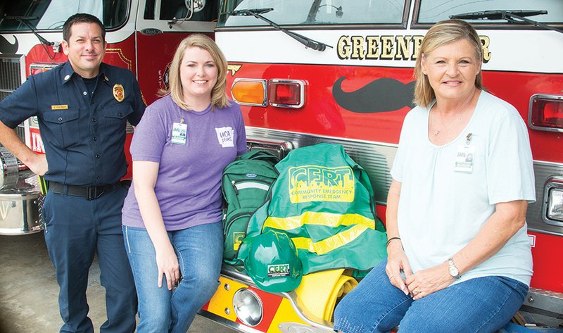 Greenbrier Fire Chief Cody Fulmer meets at the fire station with Annette Gartman of Greenbrier, center, a nurse educator for the University of Central Arkansas 
School of Nursing, whom Fulmer appointed to lead the Community Emergency Response Team that is being formed. The idea was brought to him by Joyce Johnson, right, a member of the Greenbrier City Council. Volunteers are needed and are asked to attend an organizational meeting at 6:30 p.m. July 13 at the Fire Department, 6 N. Broadview St.