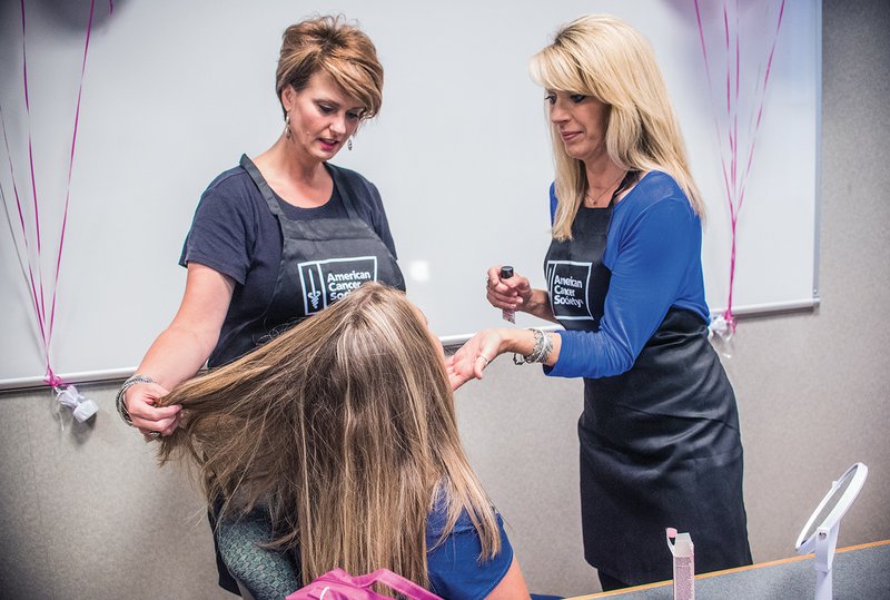 Cosmetologists Claudette Jones, left, and Jenifer Walls work on the hair and make-up of a volunteer at the White River Medical Center. The Look Good Feel Better program will take place July 14 at the White River Medical Center Cancer Care Center in Batesville.