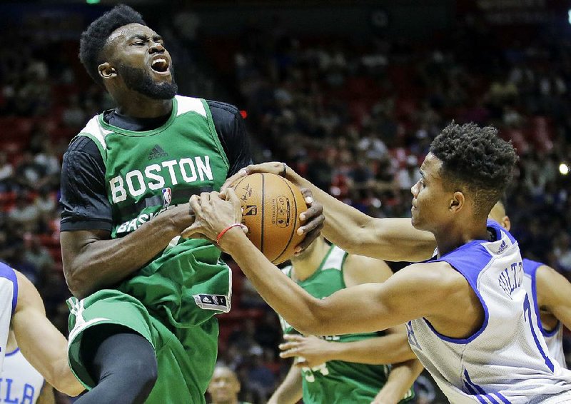 Markelle Fultz (right) of the Philadelphia 76ers, defending Jaylen Brown of the Boston Celtics during an NBA Summer League game Monday, will be used at both guard positions by the 76ers.  
