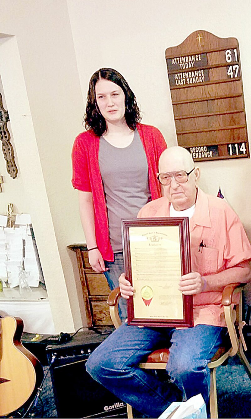 Photo suibmitted Bill Milleson, right, of Pineville, received a resolution from state Rep. Bill Lant&#8217;s office for his 30 years of service in the Navy and five tours in Vietnam. The resolution was presented by Alicia Canfield.
