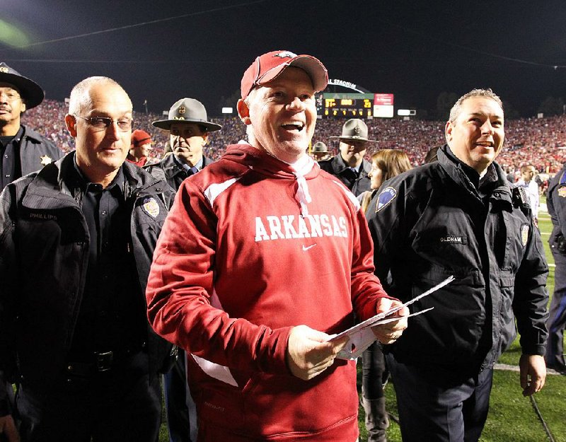 Bobby Petrino celebrates after Arkansas’ victory over LSU at Little Rock’s War Memorial Stadium in 2010. It was Petrino’s second victory against the Tigers as Arkansas’ head coach. The Razorbacks went on to play Ohio State in the Sugar Bowl in New Orleans.