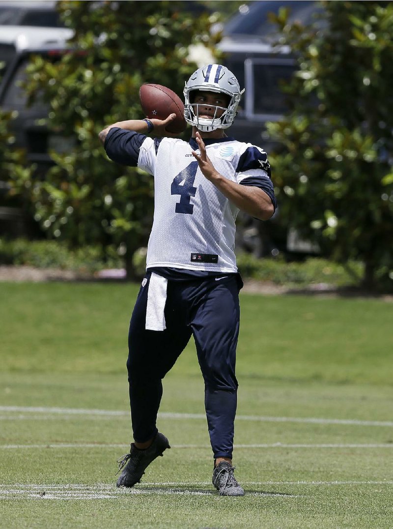 Autographs by Dallas Cowboys quarterback Dak Prescott for memorabilia companies are being created by a
machine, industry experts suspect.