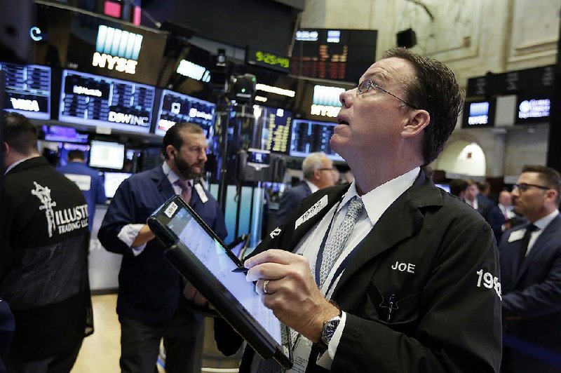 Trader Joseph Murray works Thursday on the floor of the New York Stock Exchange.