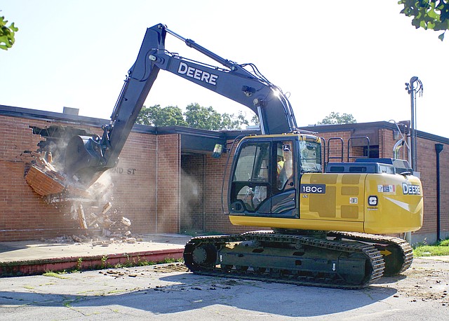 The start of demolition work at Gentry Intermediate School began shortly after 9 a.m. on Friday, July 7, 2017. Tom Smith of Red Line Construction in Lowell was operating the excavator.