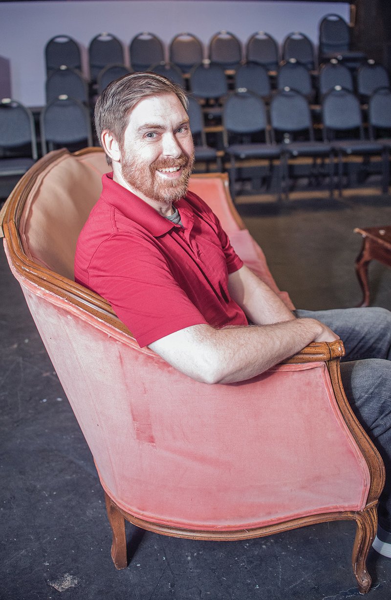 Shua Miller, treasurer for the Conway Community Arts Association Board of Directors, sits in The Lantern Theatre, the organization’s home in downtown Conway. Miller, a past president of the group, plays one of the leads in The Importance of Being Earnest, a comedy that will be performed July 20-23 and 27-30 at The Lantern. More information about the show is available at conwayarts.org.