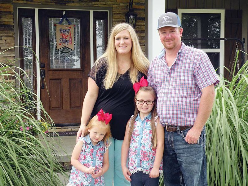 The Matt McMahan family of Damascus is the Van Buren County Farm Family of the Year. Family members include, back row, Kortney and Matt; and, front row, their daughters, Kinley, 3, left, and Karley, 5. The family raises cattle and sells livestock trailers.