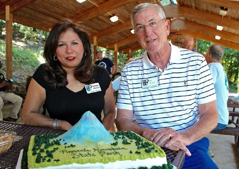 Vangie Atkinson and Bill Toland showed up at Pinnacle Mountain State Park’s Volunteer Appreciation Day cookout June 25 to find a cake decorated like the mountain and burgers grilled by the park superintendent waiting for them and other members of the Central Arkansas Master Naturalists. 