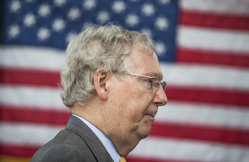 U.S. Sen. Mitch McConnell, R-Ky., speaks to members of the media after a ribbon cutting ceremony for exit 30 on Interstate 65 in Bowling Green, Ky., on Thursday, July 6, 2017. (Austin Anthony/Daily News via AP)