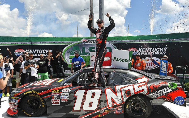 Kyle Busch (18) won the NASCAR Xfinity Series Alsco 300 by 1.097 seconds over Ryan Blaney Saturday at Kentucky Speedway in Sparta, Ky.