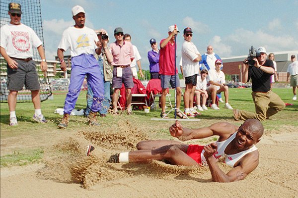 Arkansas' Erick Walder competes in the long jump at the Southeastern Conference Outdoor Track and Field Championships, Saturday, May 14, 1994 in Fayetteville, Ark. Walder improved almost three feet in the finals and won his third straight outdoor title with a jump of 27-4 3/4. (AP Photo/Tom Ewart)
