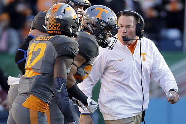 Tennessee head coach Butch Jones yells instructions to his players in the first half of the Music City Bowl NCAA college football game against Nebraska, Friday, Dec. 30, 2016, in Nashville, Tenn. (AP Photo/Mark Humphrey)
