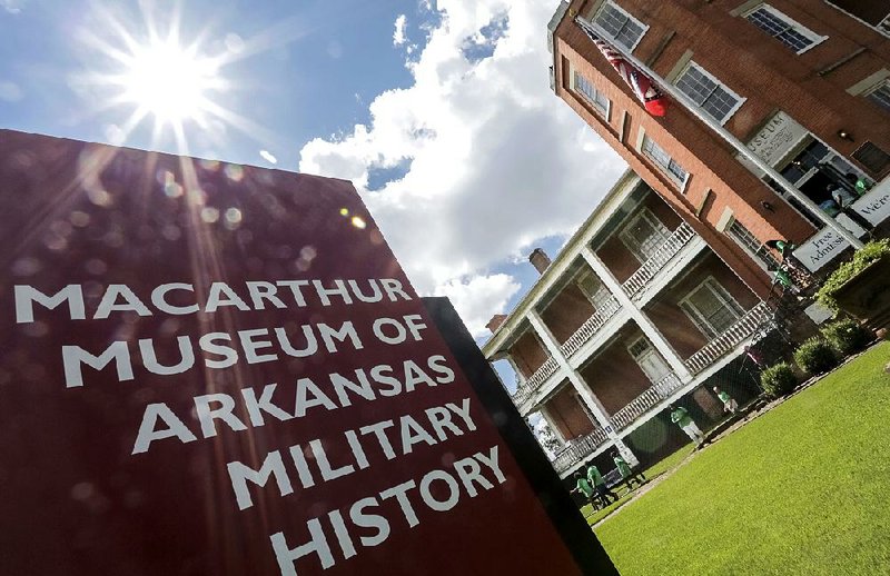FILE PHOTO: Arkansas Democrat-Gazette/JOHN SYKES JR. - A group of children leave the MacArthur Museum of Arkansas Military History in 2017. The museum was awarded a $100,000 Historic Preservation Restoration Grant to repair and renovate the building's front and back porches. The grant was awarded by the Arkansas Historic Preservation Program, a division of the Department of Arkansas Heritage that annually awards grants and money to restore historic properties.
