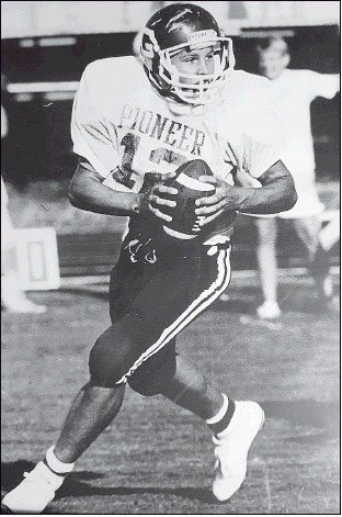 Courtesy Photo Rick Still rolls out to pass during a junior high game in 1988. As a high school senior, Still was named the All-Arkansas first-team quarterback by the Arkansas Democrat-Gazette.