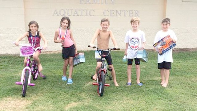 Photo submitted Pictured are the winners of the 7- to 8-year-old division of the Kids Triathlon held Saturday at the Family Aquatic Center. Winners were: Girls, first place Amelie Seauve and second place Zoe Blaha; boys, first place Deacon Maples, second place Tyler Keegan and third place Gideon Bergthold.