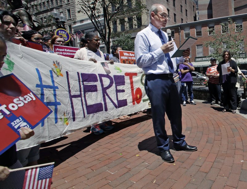 In this Thursday, July 6, 2017 file photo, Ronnie Millar, of the Boston-based Irish International Immigrant Center, addresses a "Here to Stay" rally at the Irish Famine Memorial in Boston, where immigration activists and labor groups gathered to oppose the president's crackdown on illegal immigration. Immigration and Customs Enforcement data provided to The Associated Press show that more than 1,300 Europeans were deported through June 24. About 1,450 Europeans were deported in 2016. (AP Photo/Charles Krupa)
