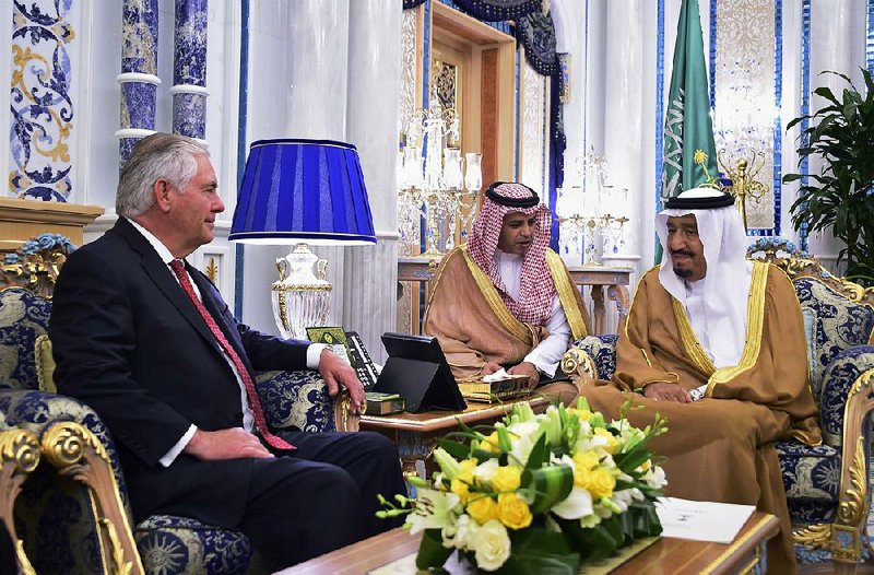 Secretary of State Rex Tillerson (left) meets with Saudi King Salman (right) in Jiddah, Saudi Arabia, on Wednesday. Tillerson has held talks with King Salman and other officials from the countries lined up against Qatar. 