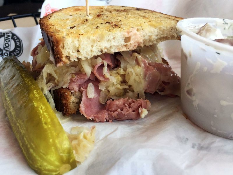 A Rockefeller Reuben, served with potato salad, features corned beef, Swiss cheese, sauerkraut and Russian dressing on rye at Gandolfo’s New York Delicatessen in Little Rock’s Promenade at Chenal. 