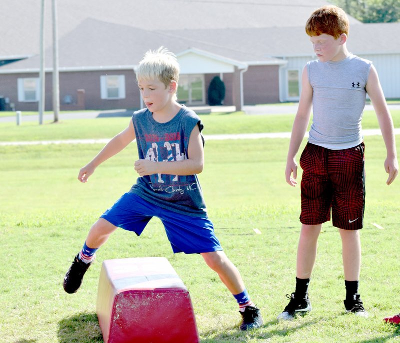 Photo by Rick Peck Brant Laughlin works on his footwork during a youth football camp held Monday at McDonald County High School.