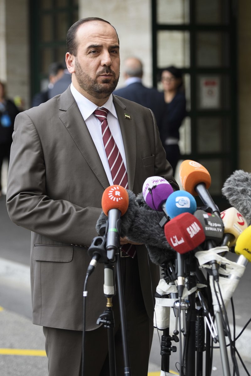 Syria's main opposition High Negotiations Committee (HNC) leader Nasr al-Hariri, speaks to the media after a round of negotiation with UN Special Envoy of the Secretary-General for Syria, during the Intra Syria talks, at the European headquarters of the United Nations in Geneva, Switzerland, Wednesday, July 12, 2017. (Martial Trezzini/Keystone via AP)