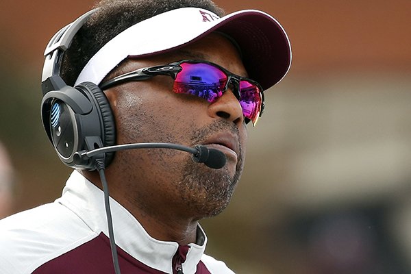 Texas A&M head coach Kevin Sumlin watches a play on the stadium video screen in the first half of an NCAA college football game against Mississippi State in Starkville, Miss., Saturday, Nov. 5, 2016. (AP Photo/Rogelio V. Solis)
