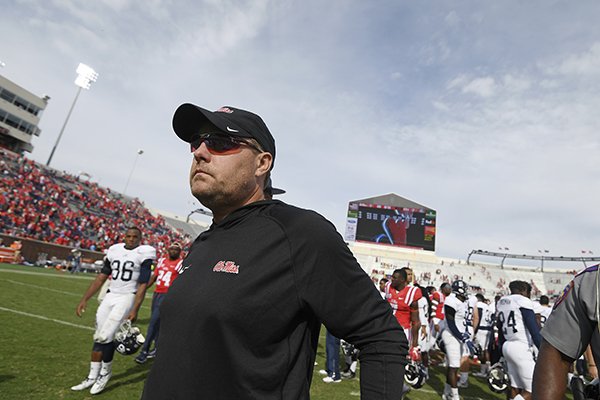 Mississippi head coach Hugh Freeze walks off the field after an NCAA college football game against Georgia Southern in Oxford, Miss., Saturday, Nov. 5, 2016. Mississippi won 37-27. (AP Photo/Thomas Graning)
