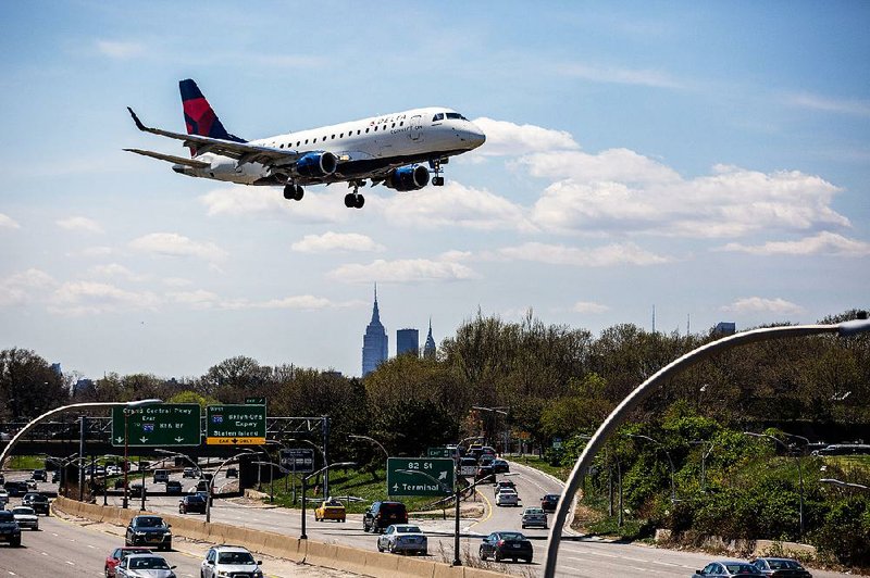 A Delta Air Lines jet descends for a landing at LaGuardia Airport in New York. The airline’s quarterly results were hurt by a stormy day in April.
