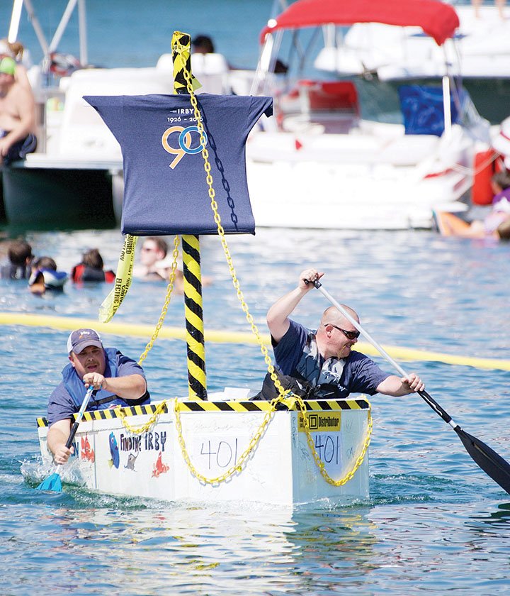 Ben Purtle, left, and Preston Rogers paddle in a boat sponsored by Irby Co., electrical distributors, during the 2016 World Championship Cardboard Boat Races on Greers Ferry Lake in Heber Springs. The 2017 competition will be July 29.