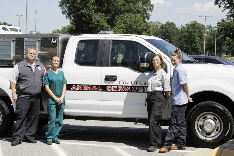 From left, Mike Wheeler, Mary Burks, Ginny Hightower and Brittney Mahoney stand in front of the new Animal Services truck at the Cabot Animal Shelter. Wheeler said the new vehicle will allow officers to be more efficient and respond to calls faster.