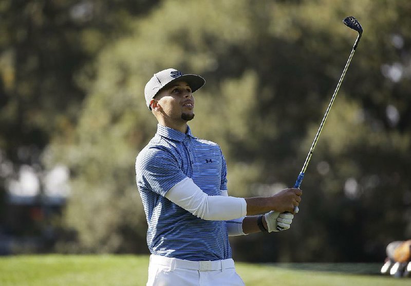 Stephen Curry of the Golden State Warriors said he would like to have Charles Barkley as his caddie but
would load the bag with bricks after all of the criticism Barkley has made about Curry and the Warriors.