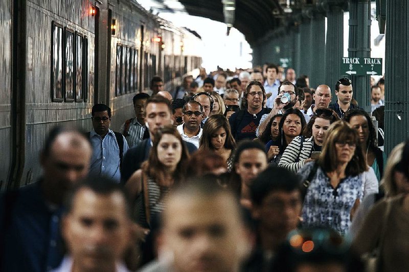 Commuters arrive earlier this week at the Hoboken, N.J., train terminal, where some New Jersey Transit rail lines are being diverted during repairs on Amtrak’s tracks. 